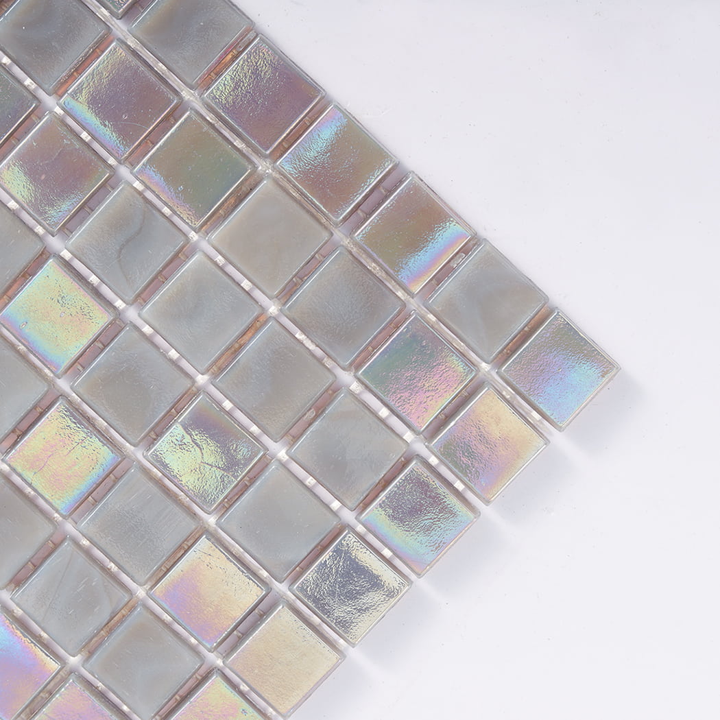 Close up of corner area showing iridescent light gray square glass floor tile texture