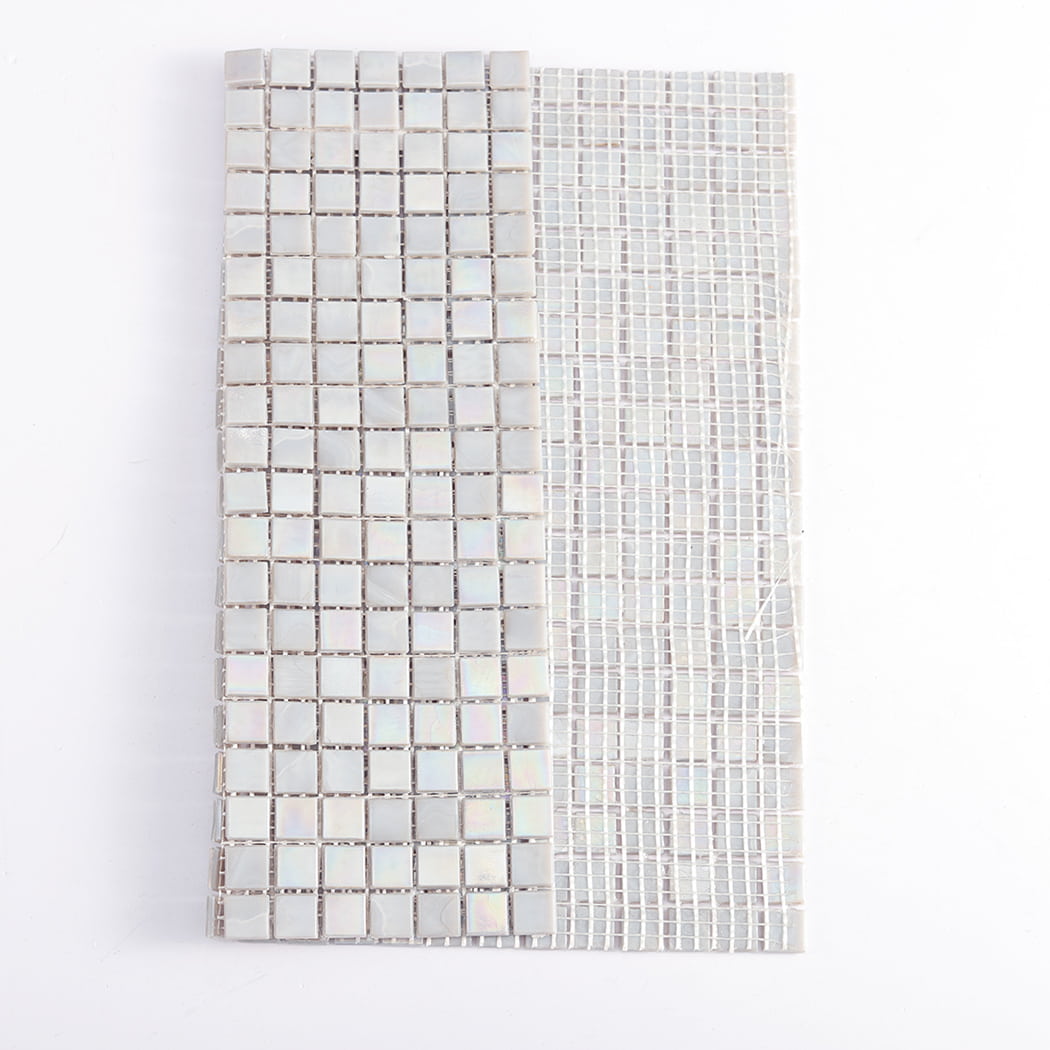 Light gray iridescent square glass mosaic tiles showing flexible mesh backing