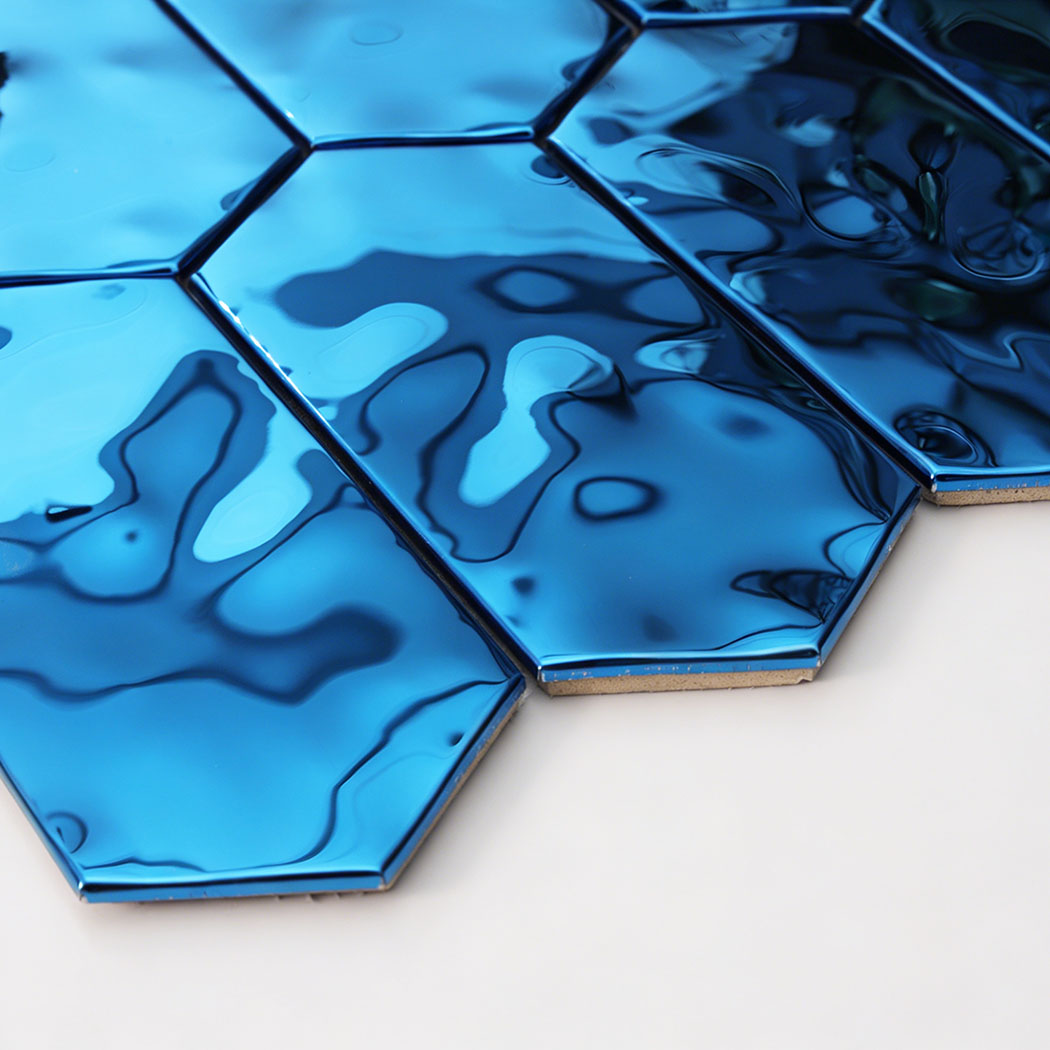 Macro view of reflective blue hexagon stainless steel tile with fluid texture