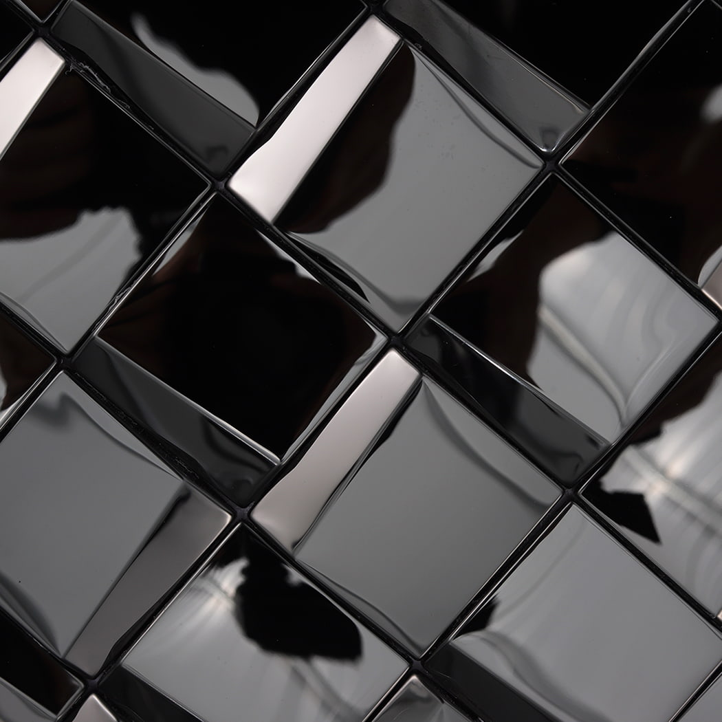 Macro view of high gloss black metallic tiles showing deep reflections and 3D texture.