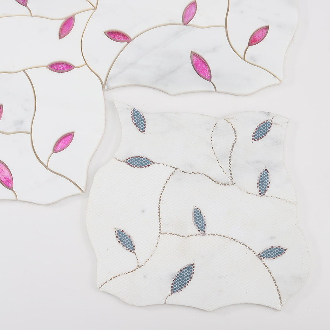 Back side of marble and glass mosaic tile sheet with mesh backing for installation