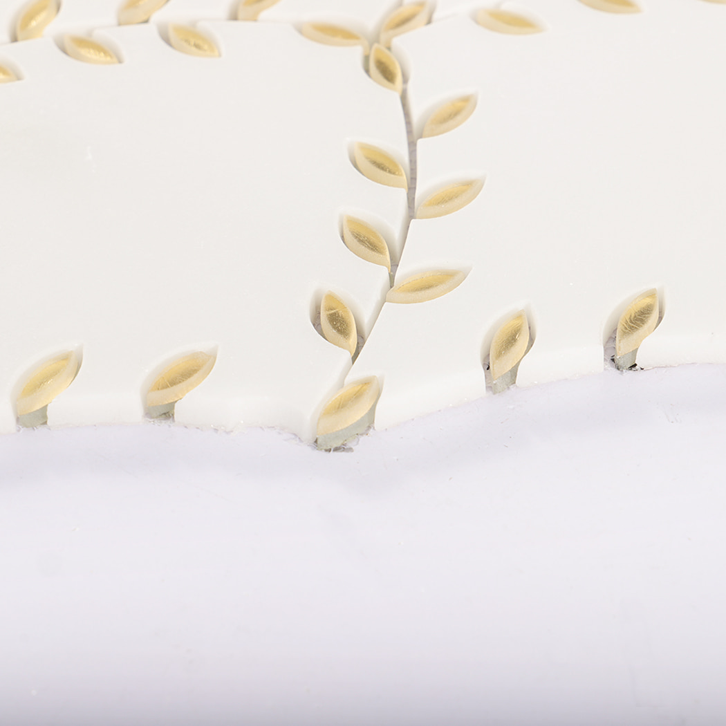 Bottom edge close-up of a marble tile with gold leaf decorations.