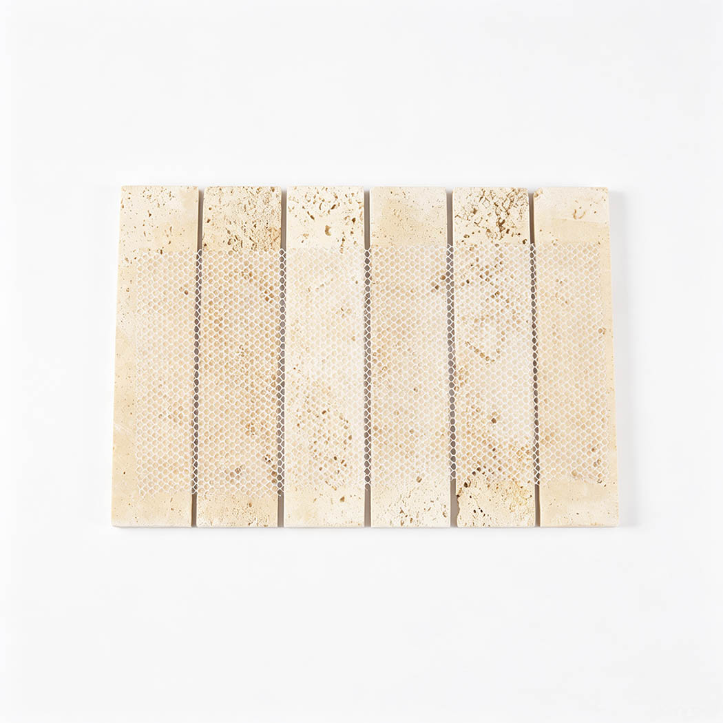 Back view of beige travertine strip mosaic tile with mesh mounting