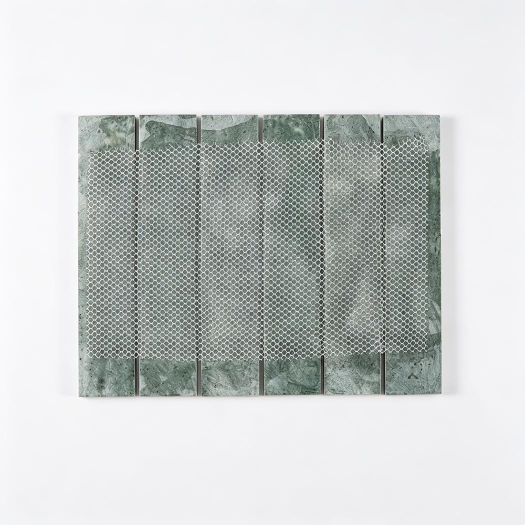 Back view of dark green marble strip tile sheet with white mesh mounting