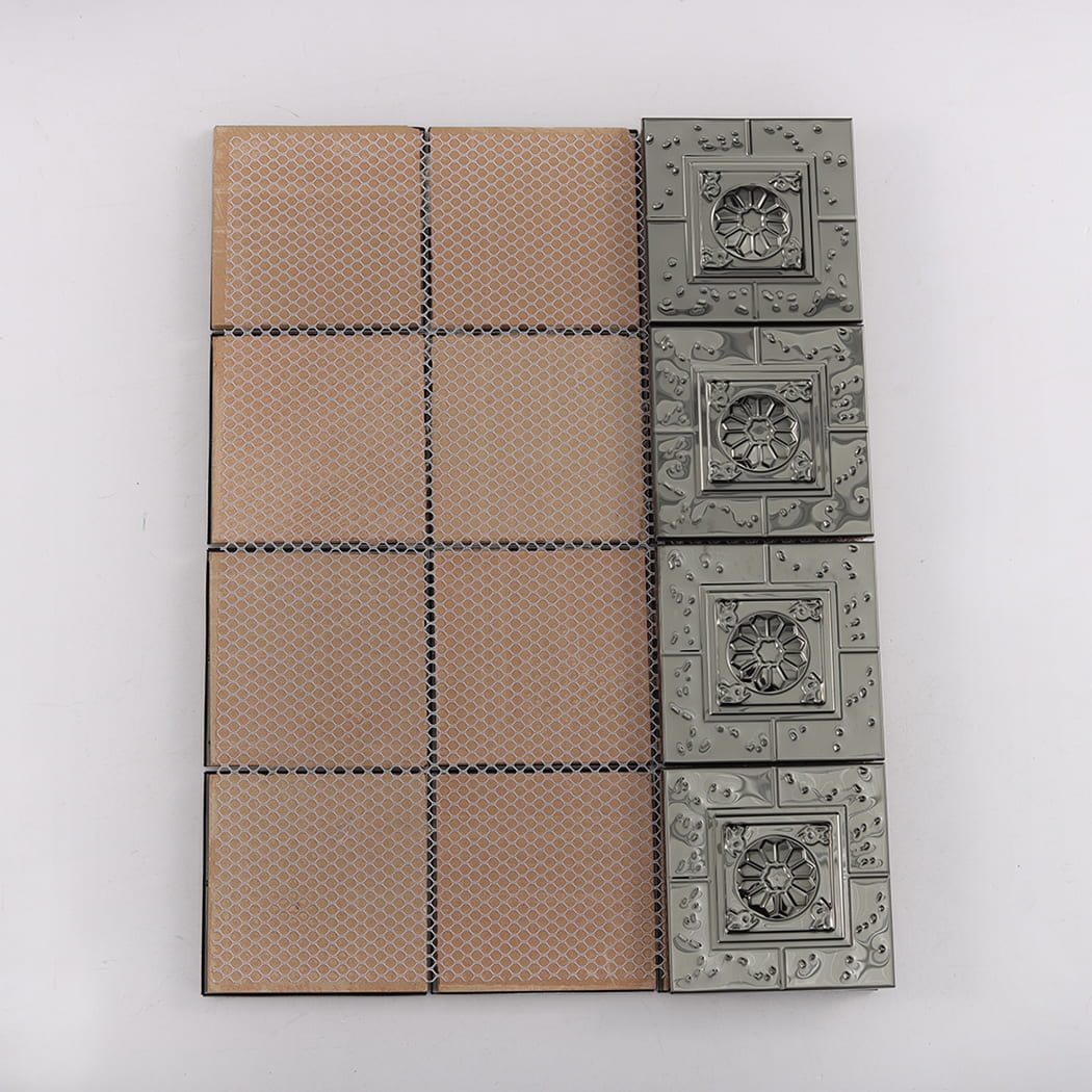 Back view of black metal mosaic tiles mounted on mesh backing