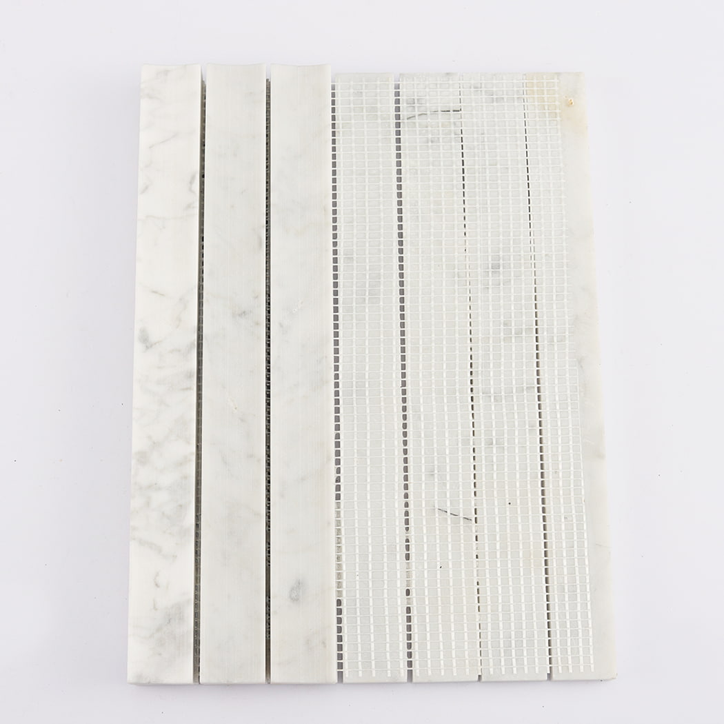 Back view showing the white mesh mounting of the Carrara White fluted marble mosaic sheet.