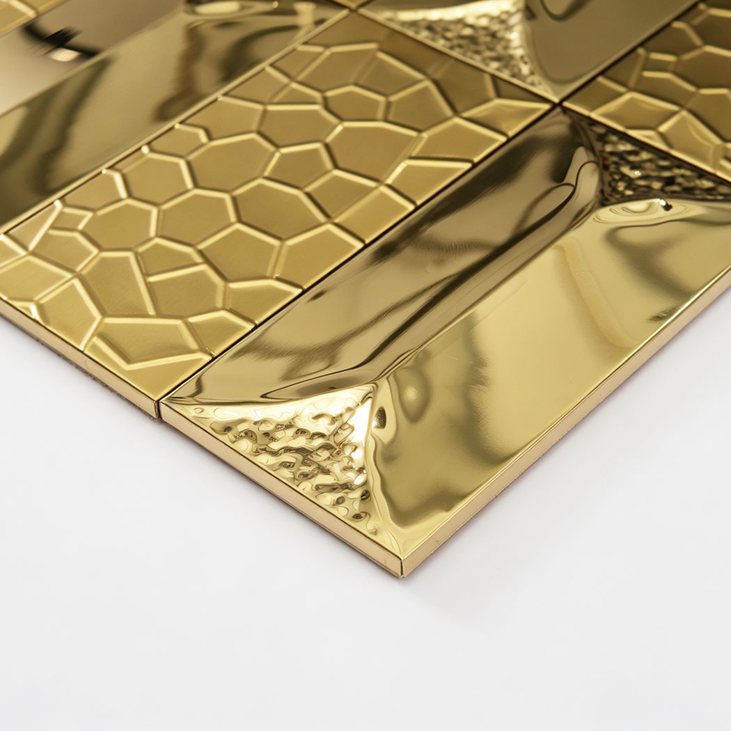 Gold metal tile backsplash with rectangular mosaic tiles and glossy finish