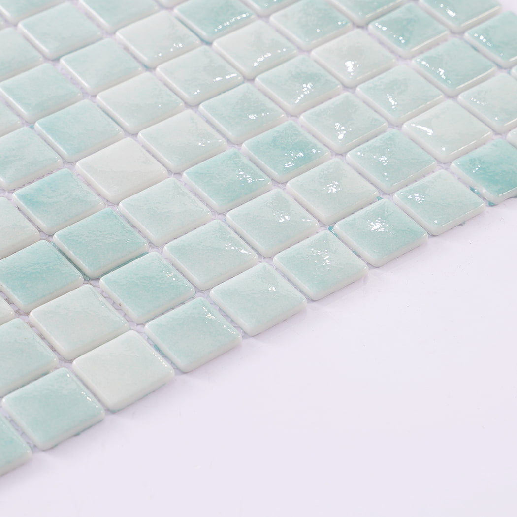 Side view of mint green mosaic tiles showing the thickness of each tile.