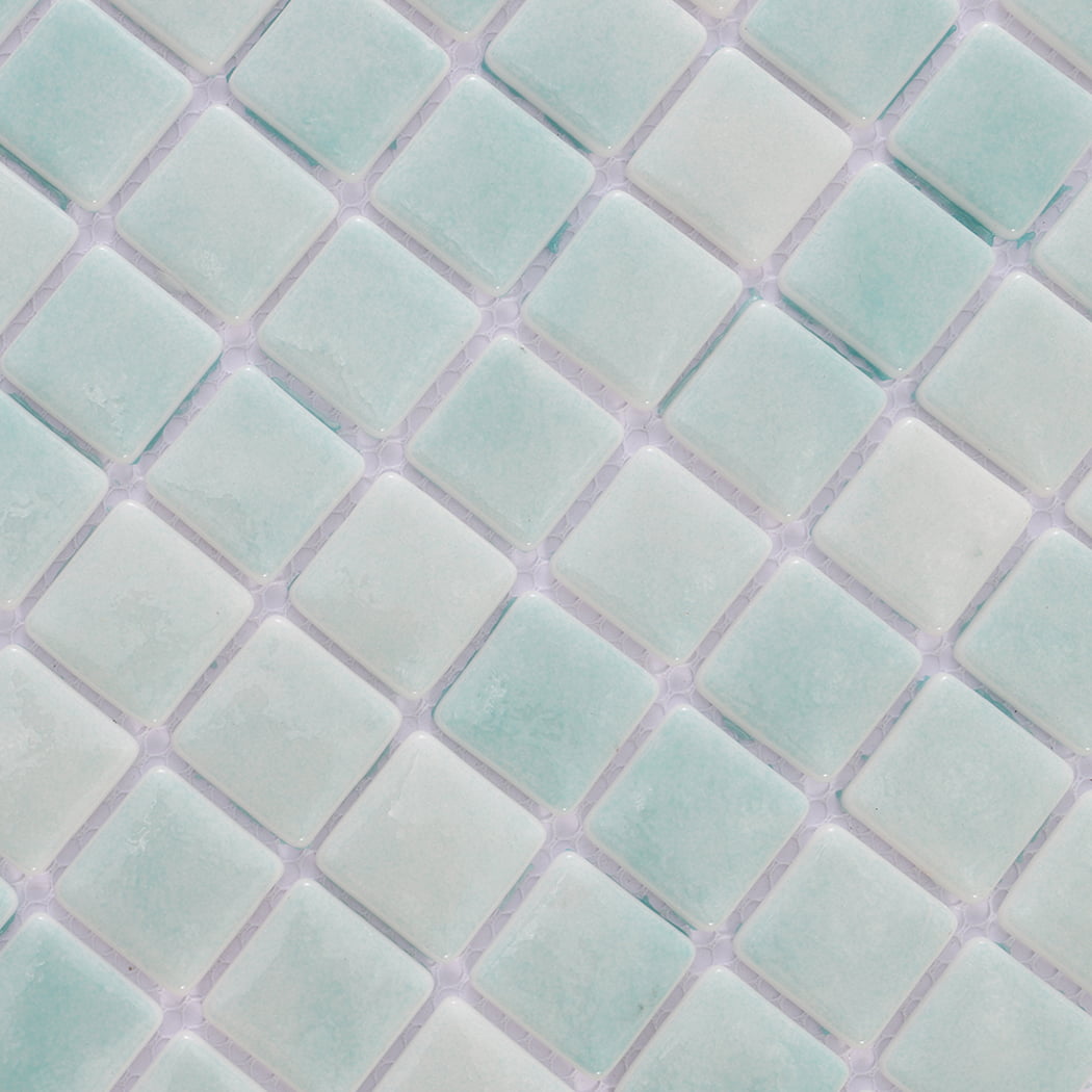 Detailed close-up of mint green mosaic tiles with subtle color variations.