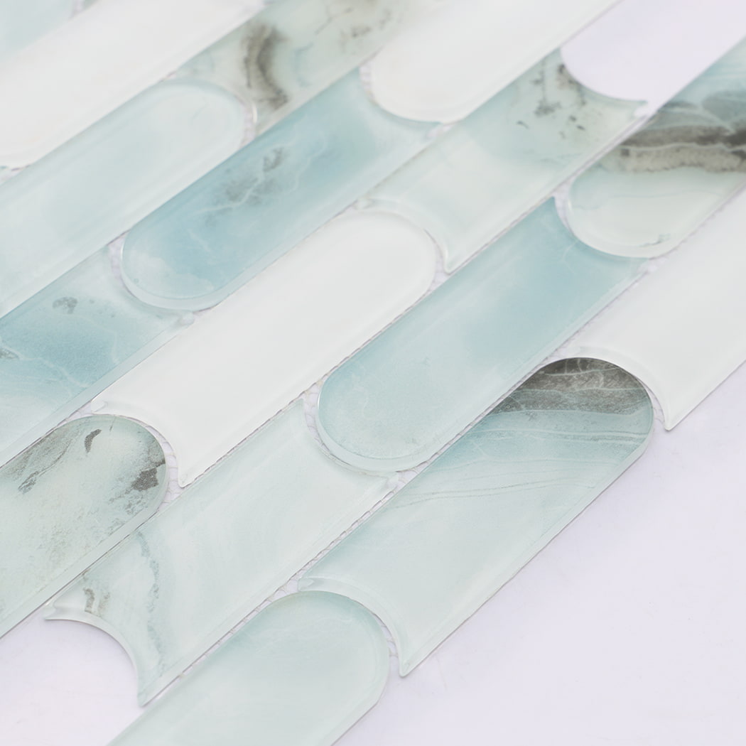 Detailed view of mint green and white interlocking pill shaped glass mosaic pattern