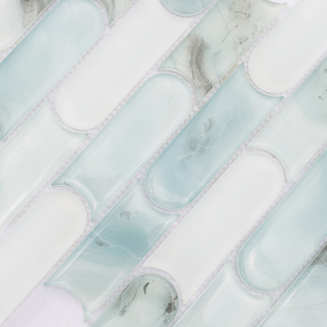 Mint green and white interlocking pill shaped glass mosaic tile surface detail