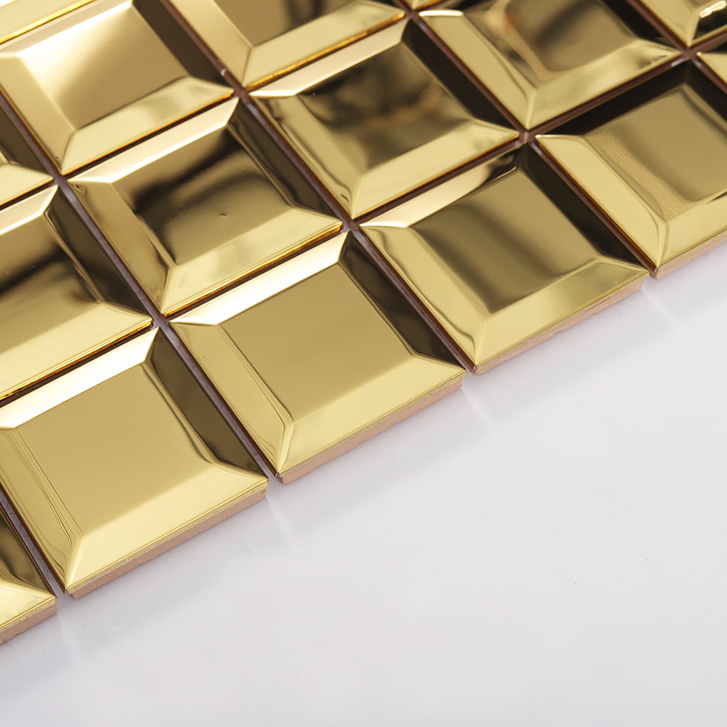 Angled side view of mirror gold beveled stainless steel mosaic tiles showing thickness