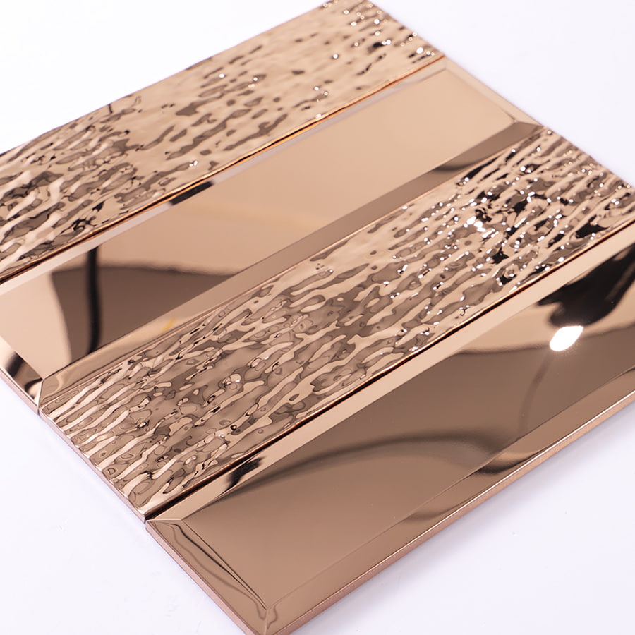 Angled view of mirror rose gold stainless steel mosaic tile with 3D texture design