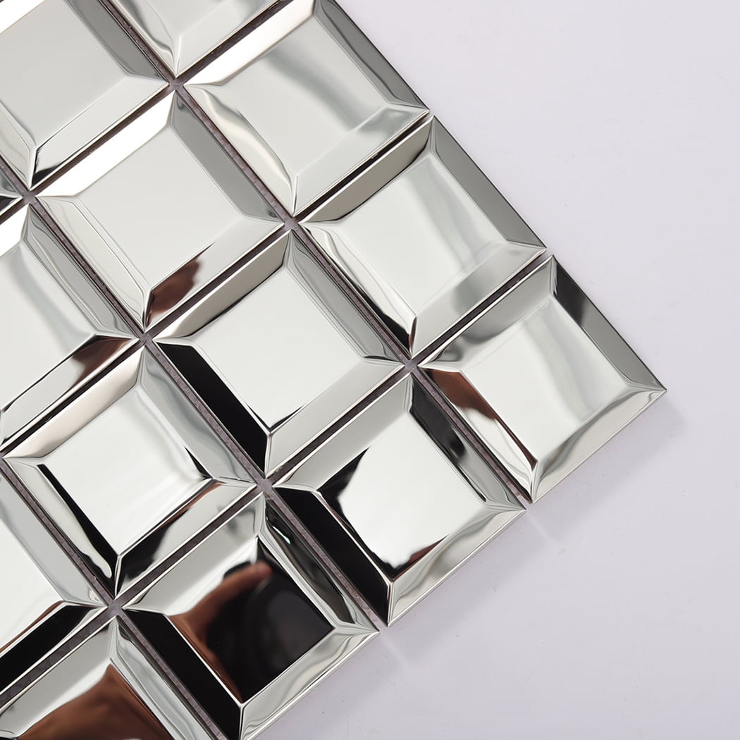 Close up of mirror silver beveled stainless steel mosaic tile corner