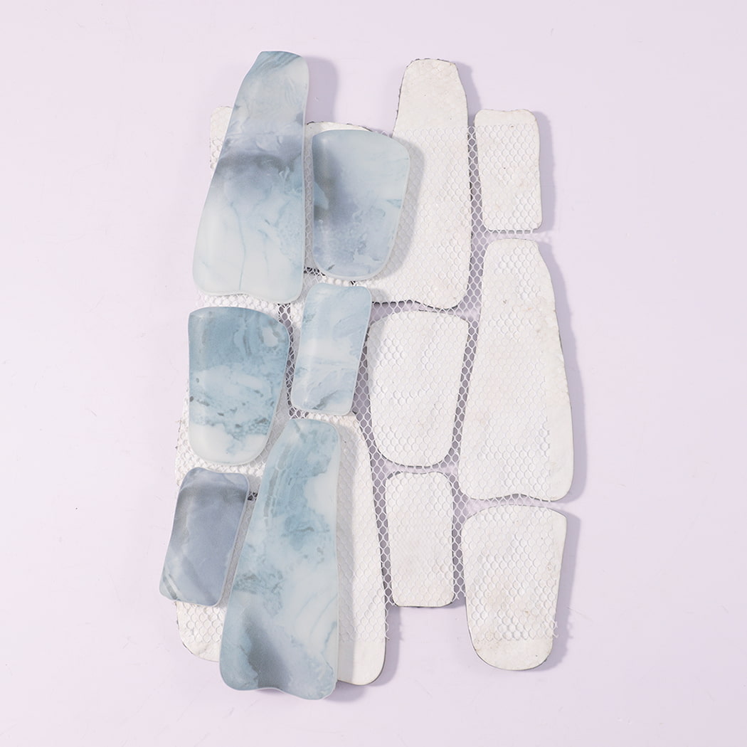 Back view of misty blue irregular pebble glass tile sheet with mesh backing