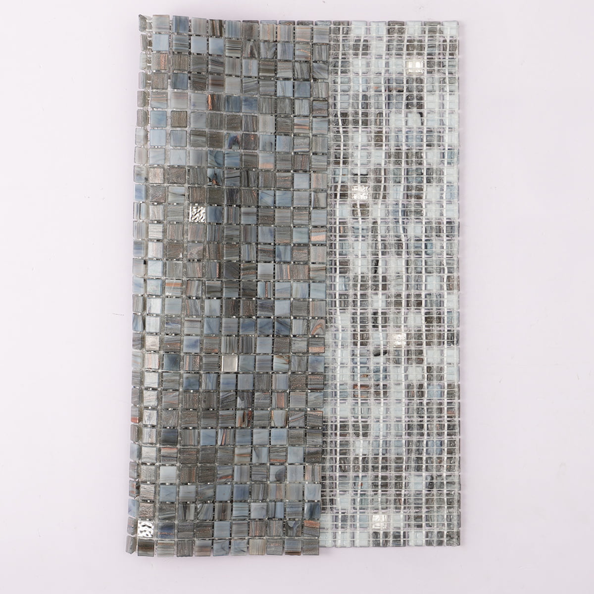 Mixed gray glass mosaic tile with glossy and matte square pieces in a vertical blend layout