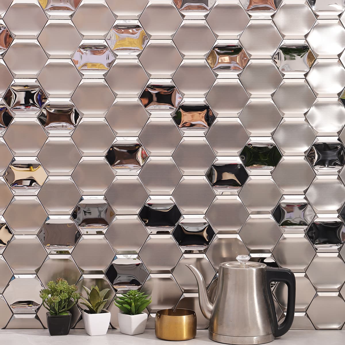 Modern kitchen backsplash with reflective silver hexagon stainless steel tiles.