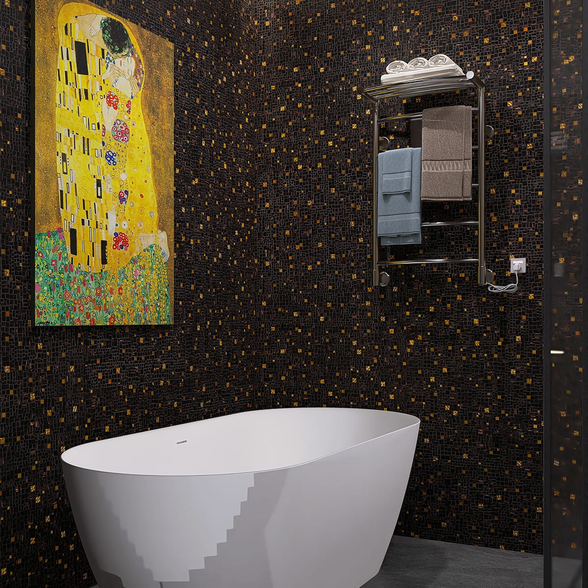 Modern bathroom with a freestanding tub against a black and gold mosaic tile feature wall