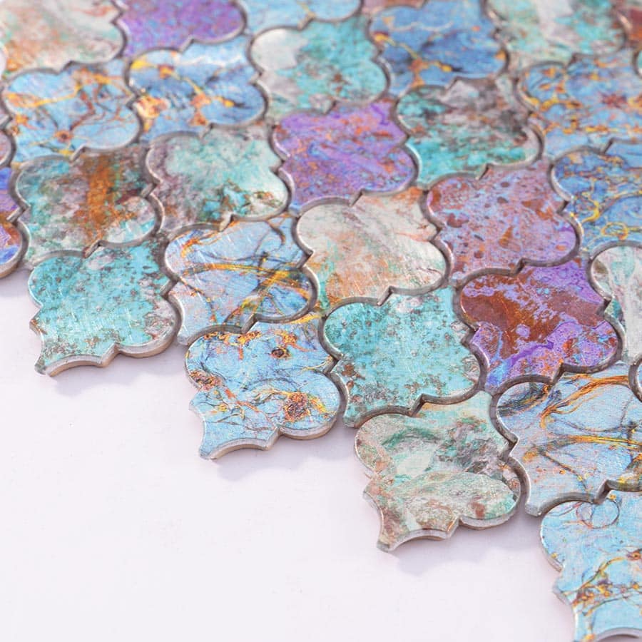 Angled view of Moroccan aluminum tiles showing edge thickness and natural iridescent colors.