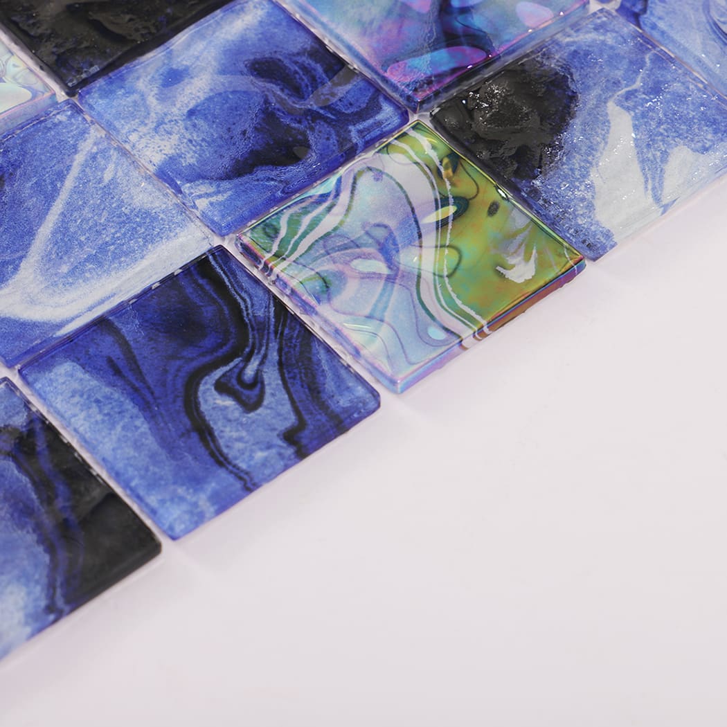 Glossy navy blue and iridescent square glass mosaic tile surface detail