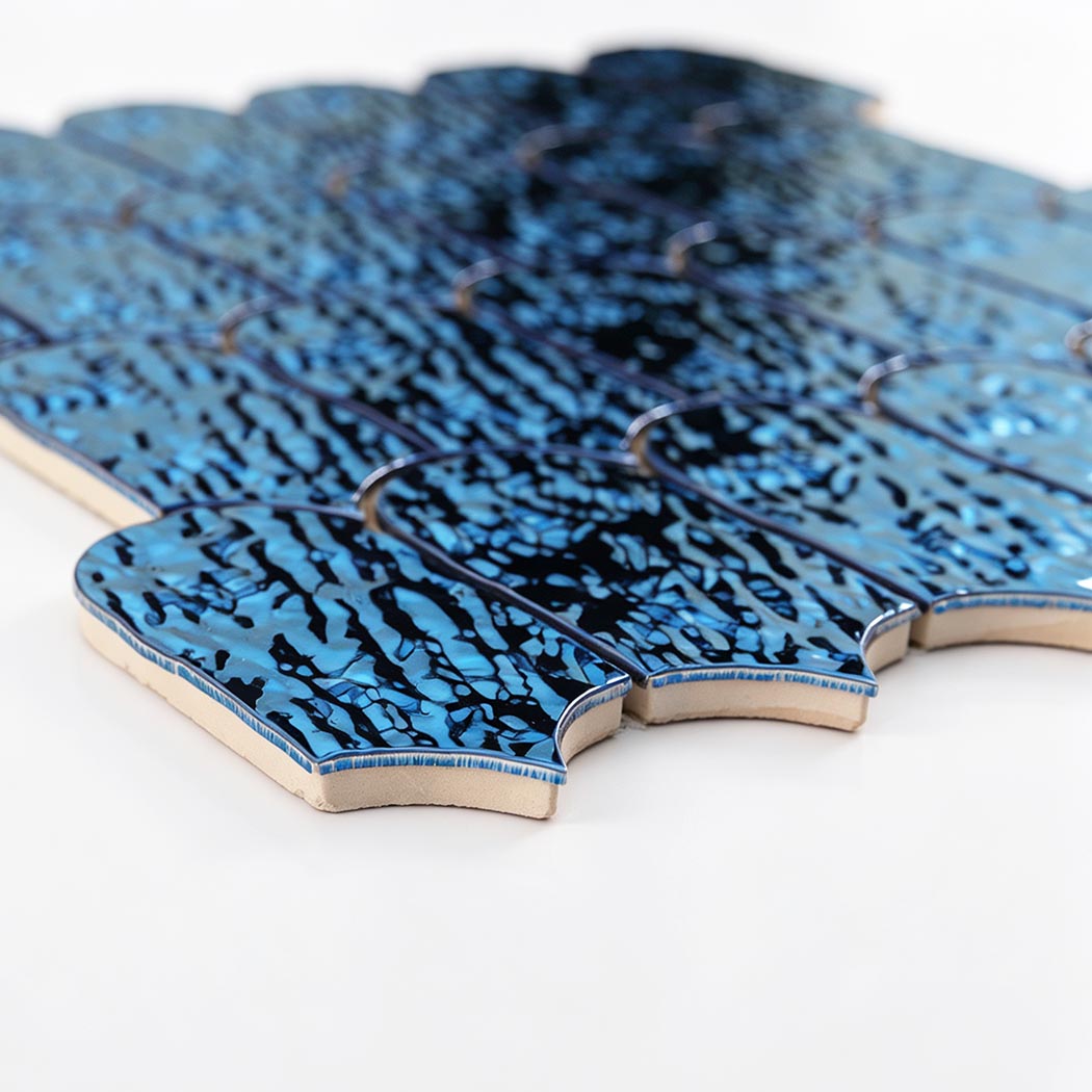 Side detail showing the thickness of ocean blue ripple scallop mosaic tiles