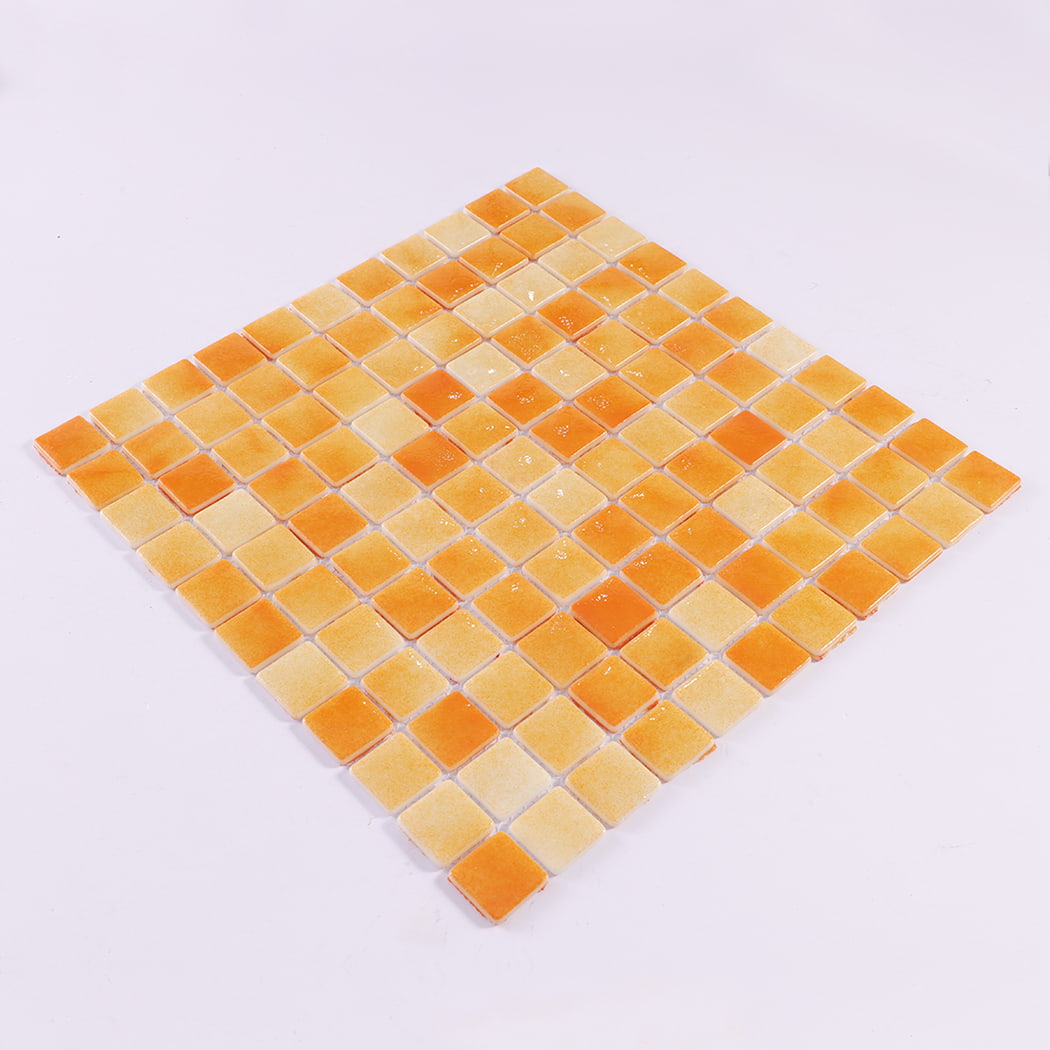 Angled view of orange recycled glass square mosaic tile sheet
