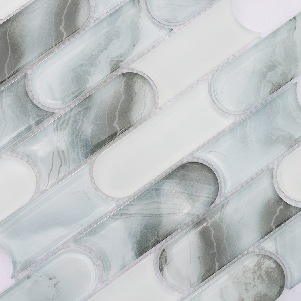 Pale blue gray patterned and white rounded linear glass mosaic surface detail