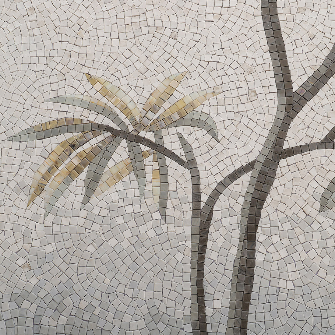 Palm tree detail in handmade mosaic mural with white and gray background tiles