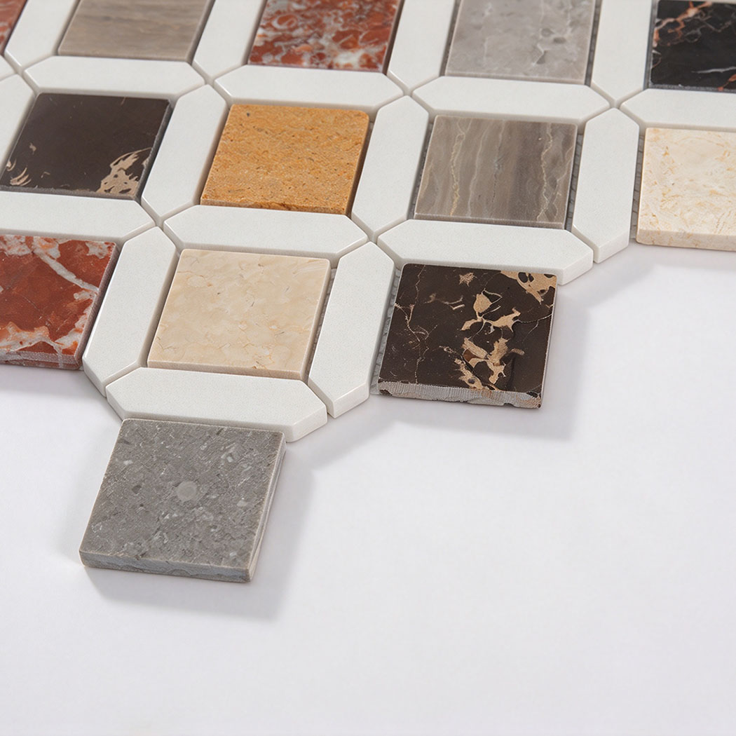 Angled close-up showing the texture of multicolor marble mosaic tile