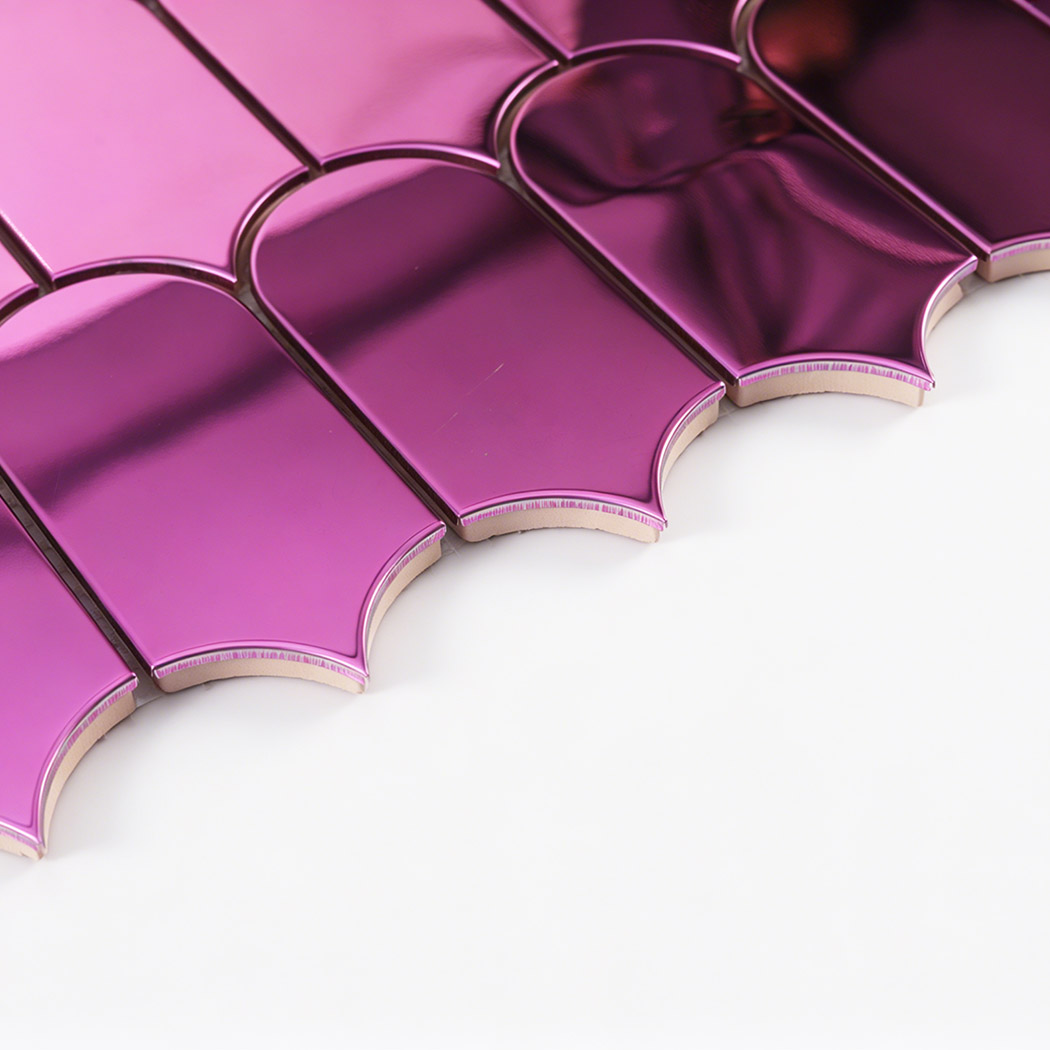 Side close up of pink arch metal mosaic tile showing thickness and curved edges