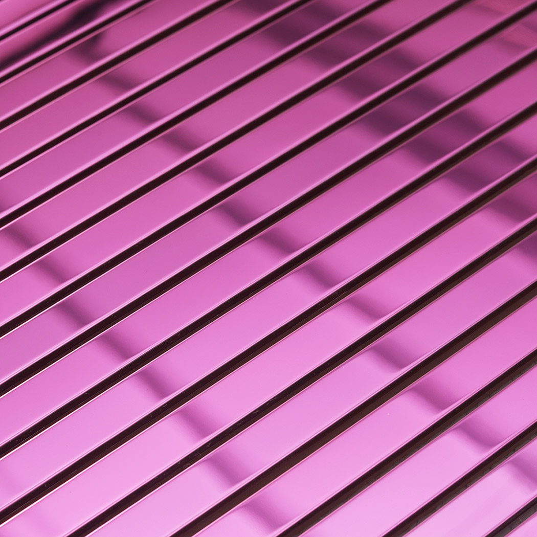 Close-up of pink mirror stainless steel pencil tile strips