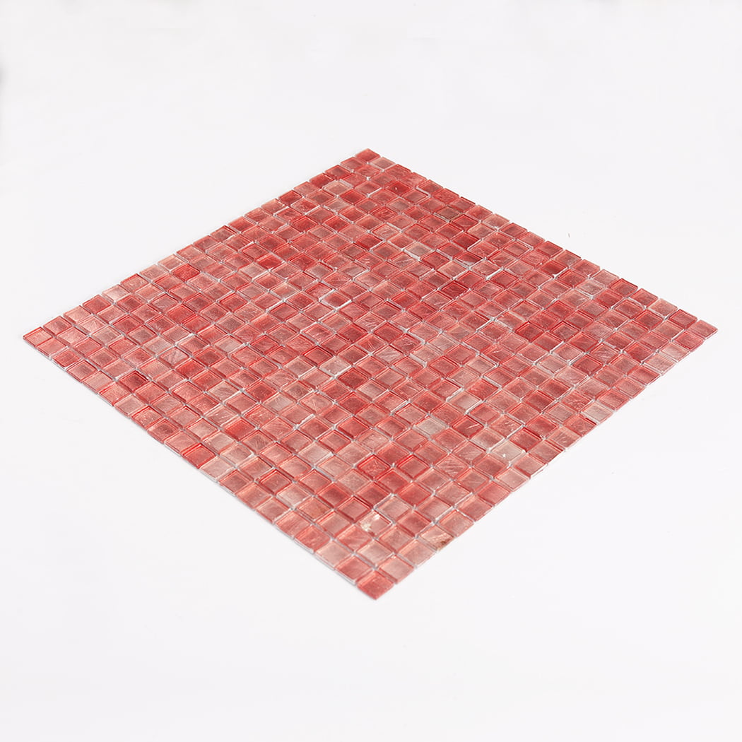 Three quarter view of pink glass mosaic tile sheet on white background