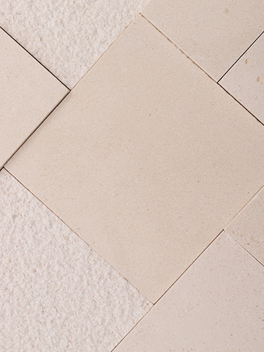 Plain beige tiles in diagonal marble layout with mixed textures