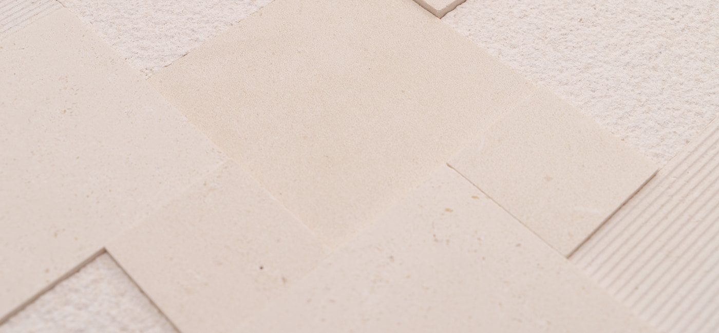 Plain beige tiles with soft marble textures in close-up view
