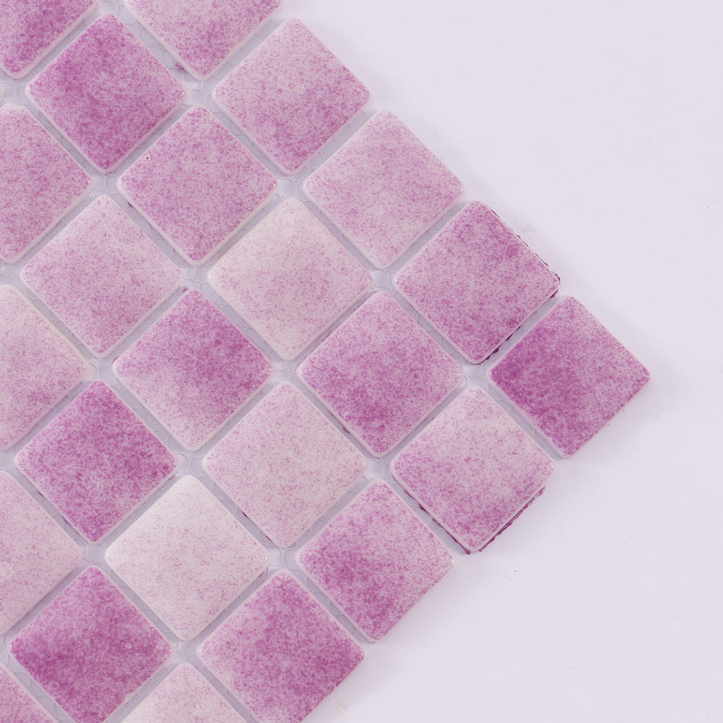 Angled close-up of purple recycled glass mosaic tiles showing texture.