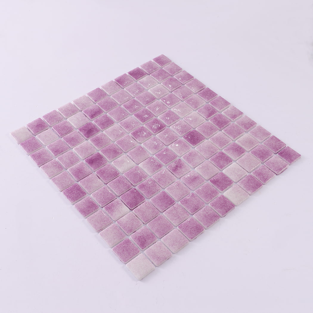 Angled view showing a full sheet of purple recycled glass mosaic tiles.