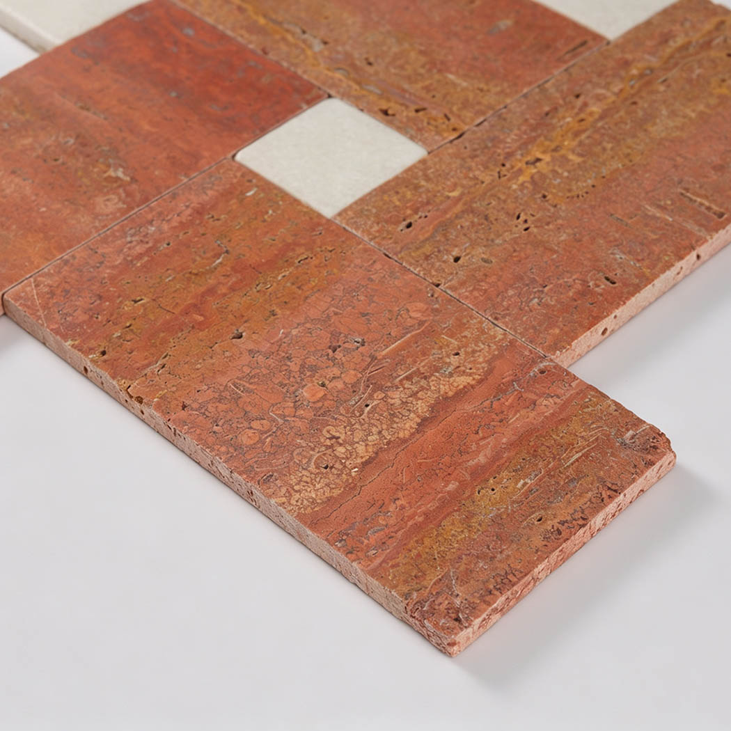 Angled view of red travertine tile showing its natural surface and thickness