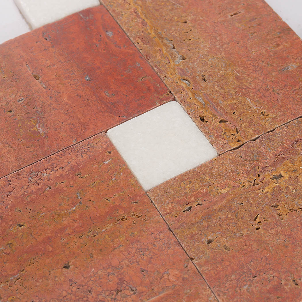 Detailed red travertine geometric pattern with a white marble square accent
