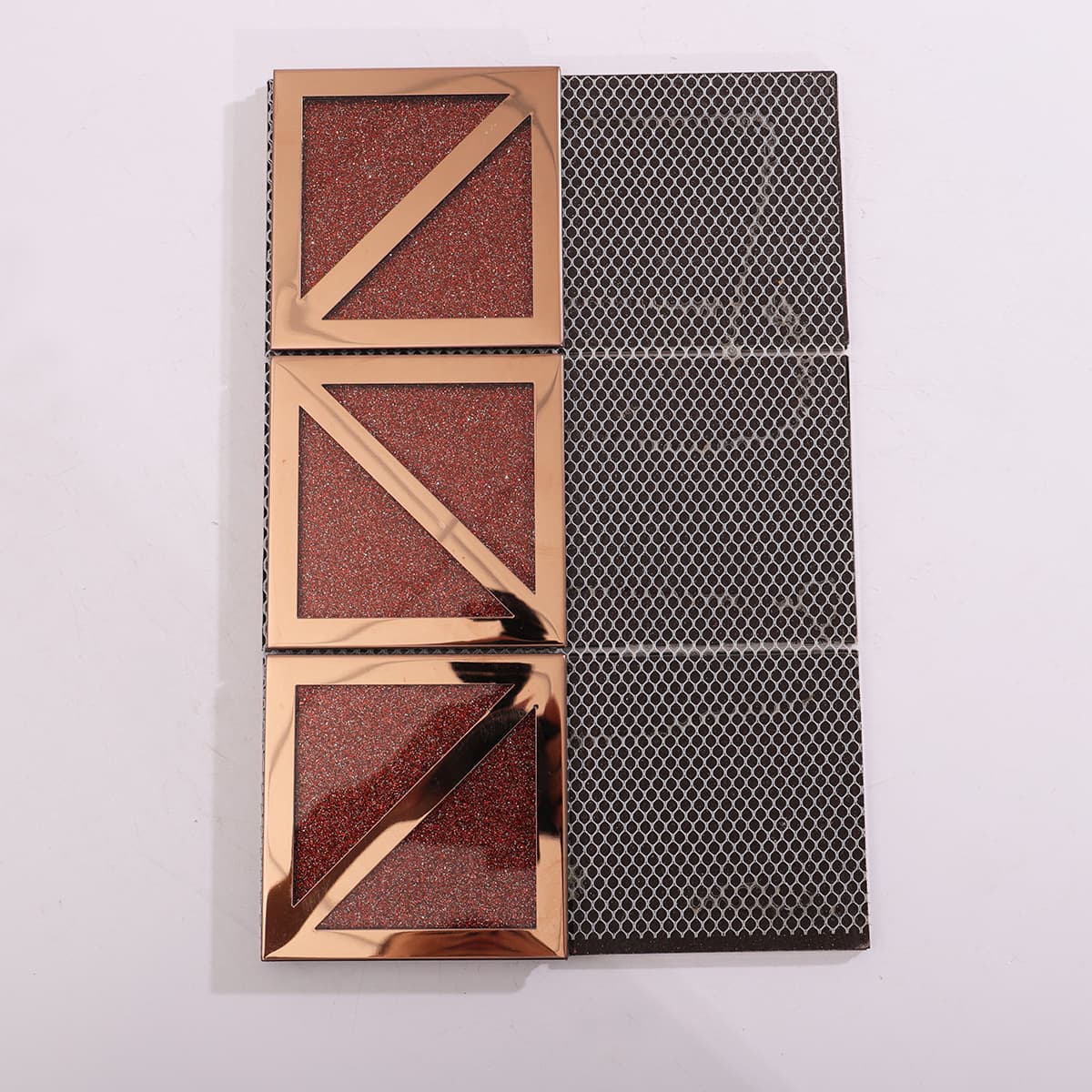 Back view of red glitter glass with rose gold metal frame