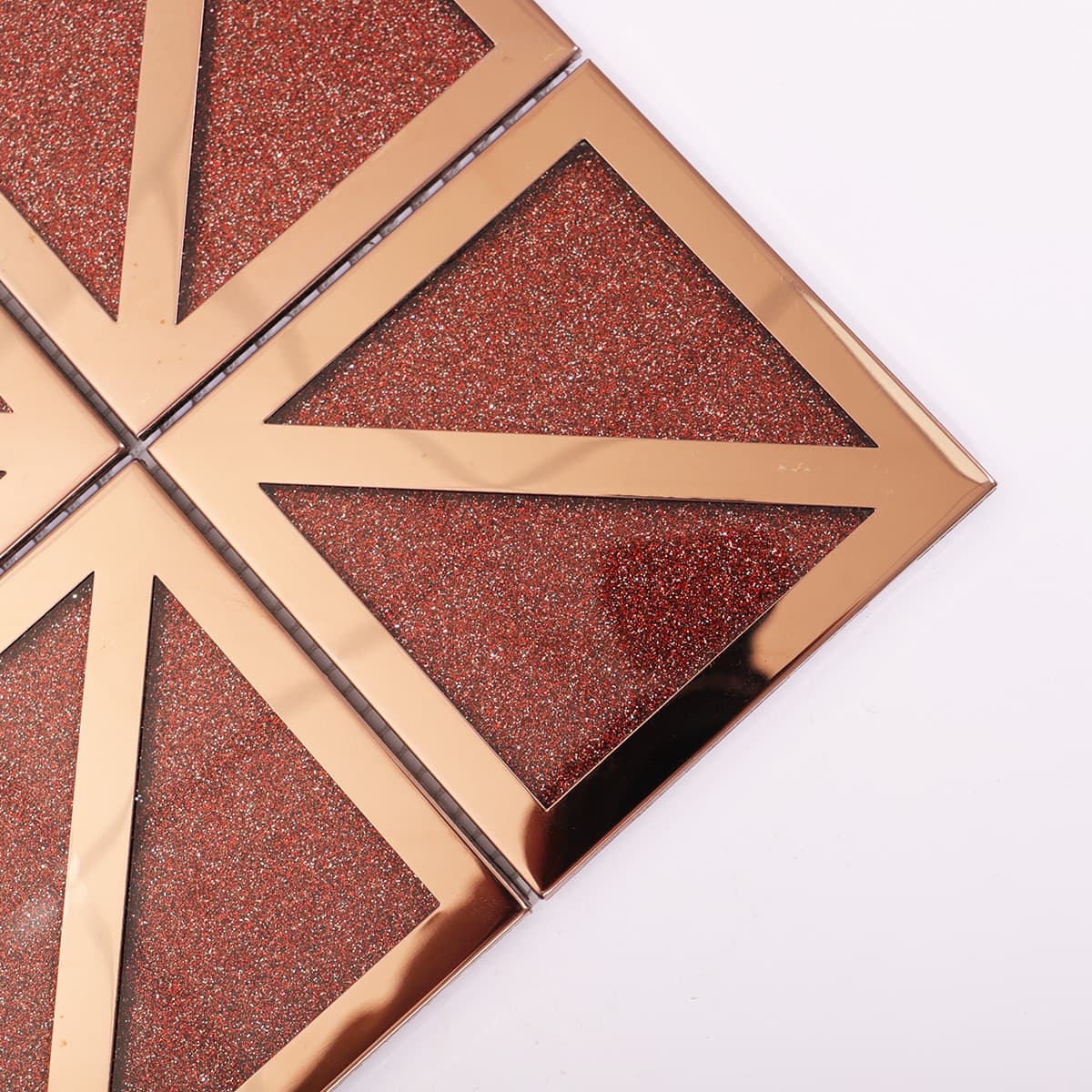 Close-up of red glitter glass with rose gold frame