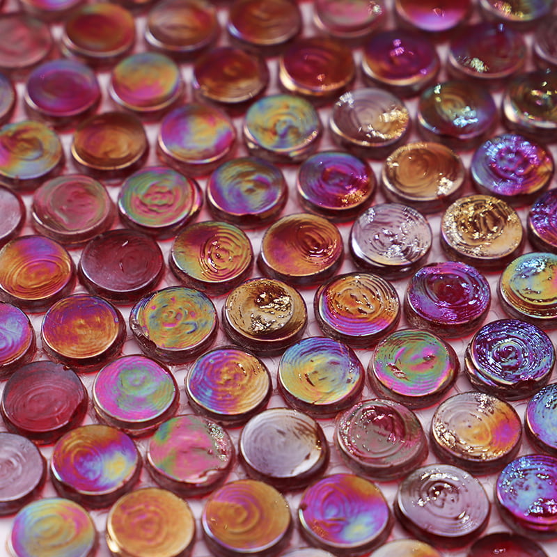 Close-up of red round iridescent glass mosaic tiles with gold-leaf backing 