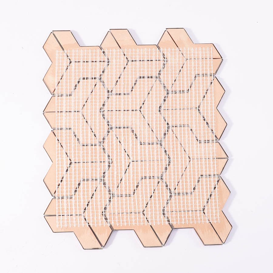 Back view of rose gold 3D wall tile with mesh