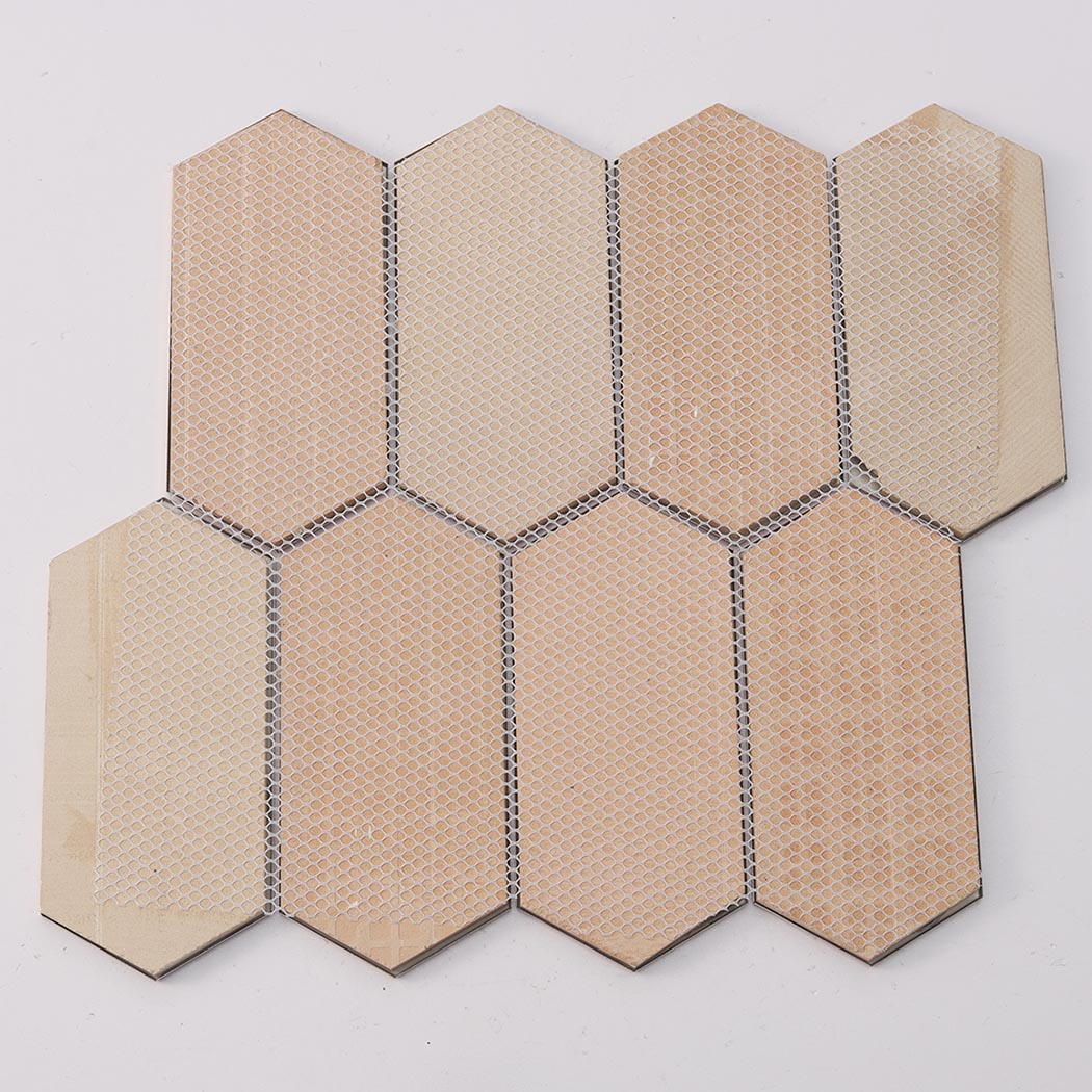 Rear view showing mesh backing of rose gold brushed and mirror elongated hexagon mosaic tile