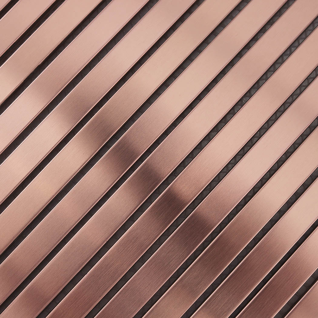 Close-up of rose gold brushed stainless steel ribbed tile strips