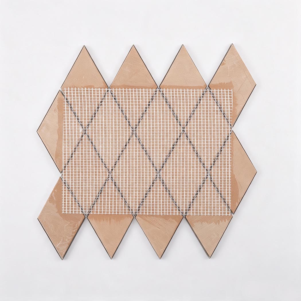 Back view of rose gold diamond metal mosaic tile sheet with mesh backing