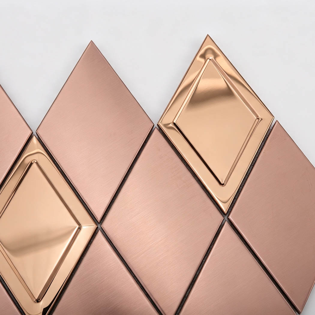 Close-up of brushed rose gold and mirror diamond metal mosaic tile texture