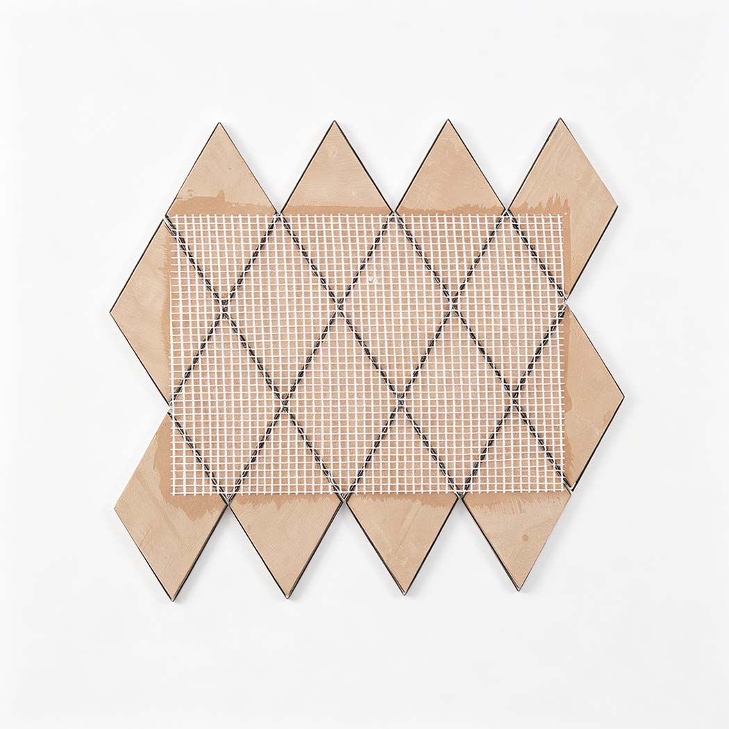 Back view of rose gold diamond stainless steel mosaic tile sheet with mesh backing