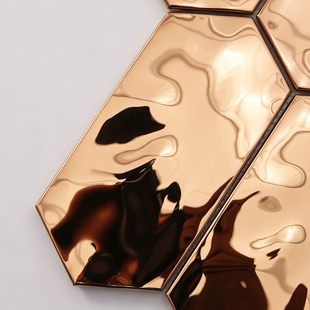 Close up of glossy rose gold long hexagon stainless steel mosaic tile surface texture