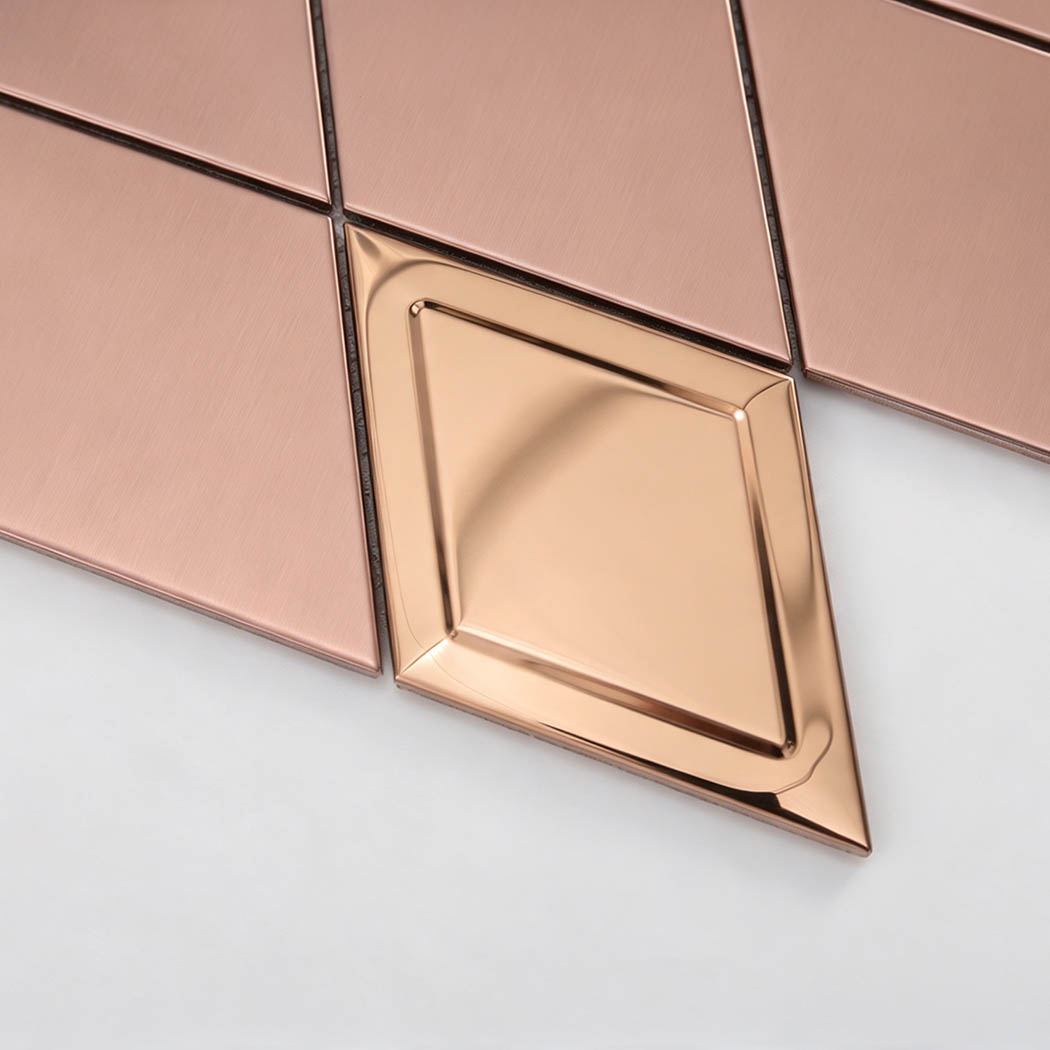 Close-up of raised mirror rose gold diamond metal mosaic tile accent