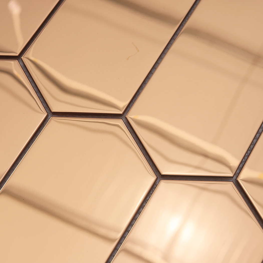 Angle view rose gold mirror elongated hexagon mosaic reflective surface